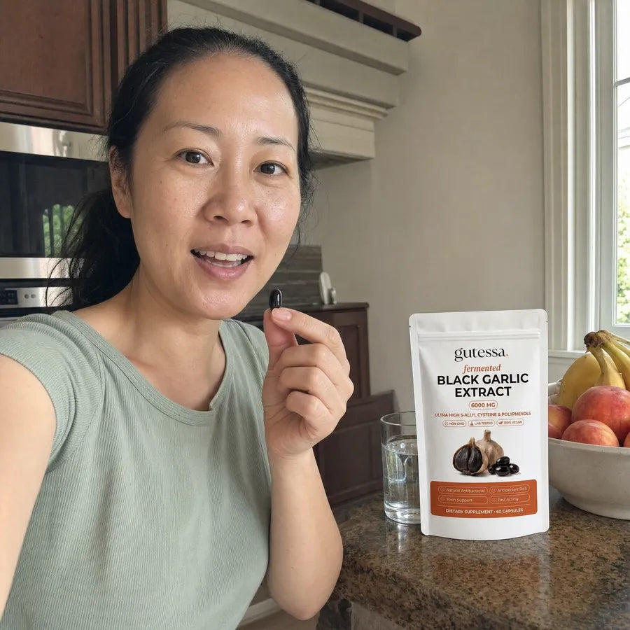 Nicole taking her daily Gutessa capsule