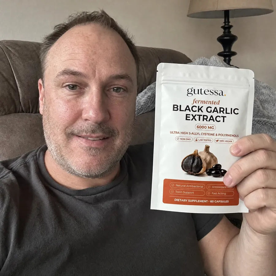 Mark holding his Gutessa pouch on the couch