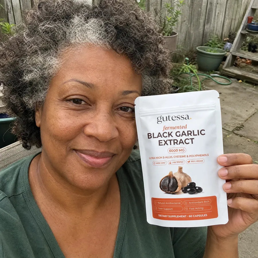 Linda holding her Gutessa pouch on the patio