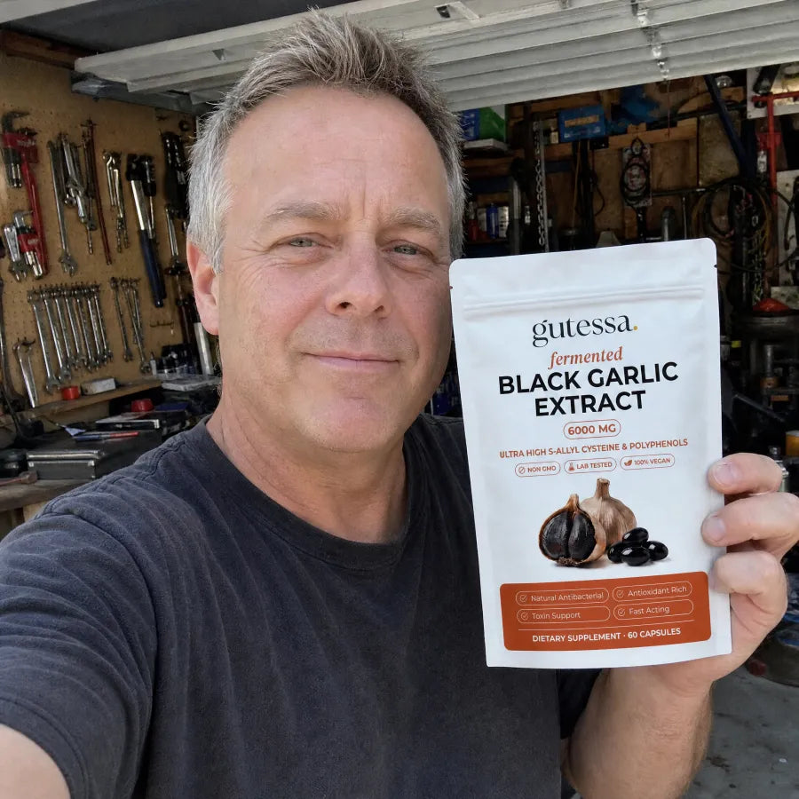 Greg holding his Gutessa pouch in the garage