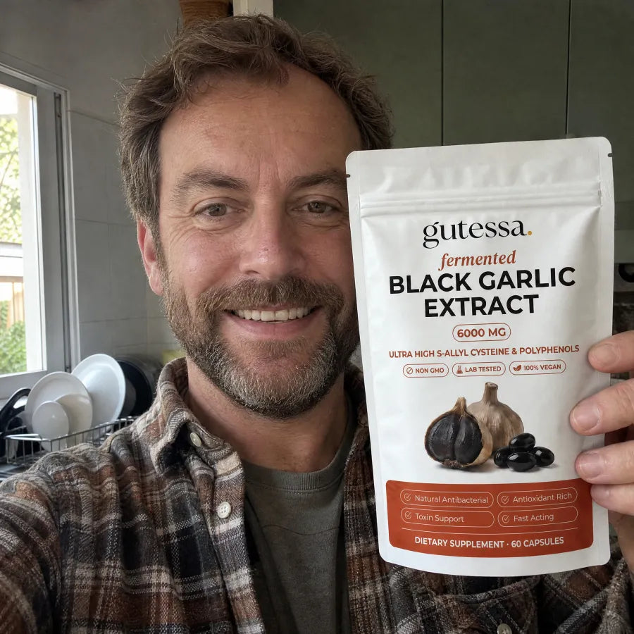 Dan holding his Gutessa pouch in the kitchen
